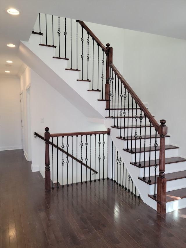 stairs with hardwood / wood-style floors