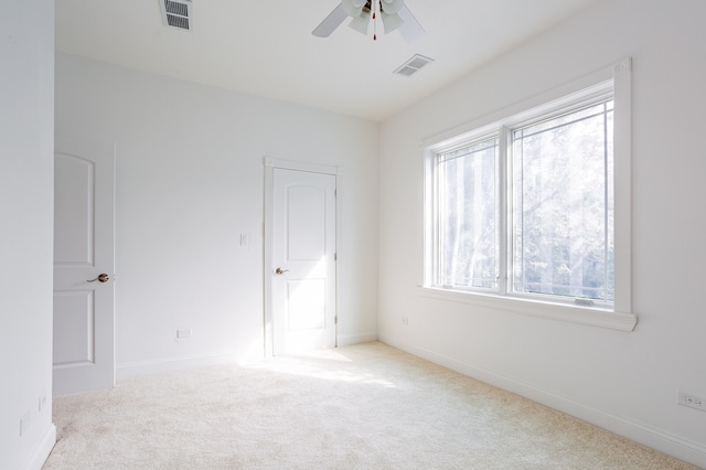 carpeted empty room with ceiling fan