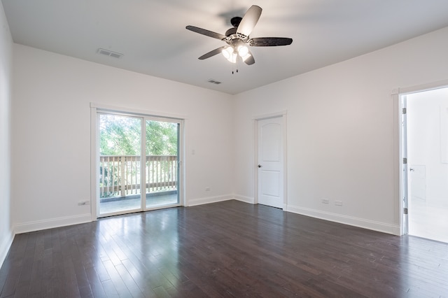 empty room featuring ceiling fan and dark hardwood / wood-style flooring