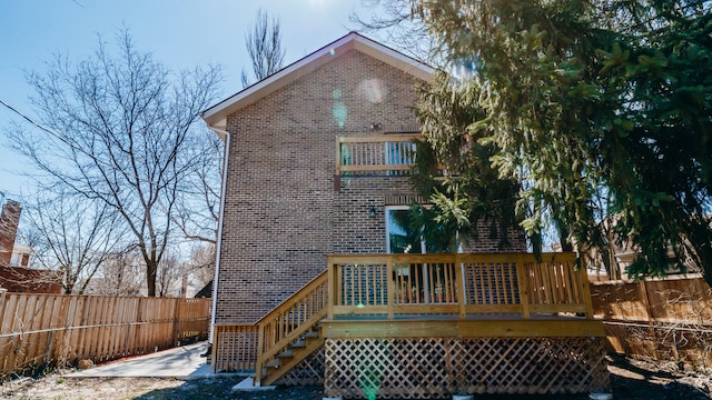 rear view of house featuring a deck