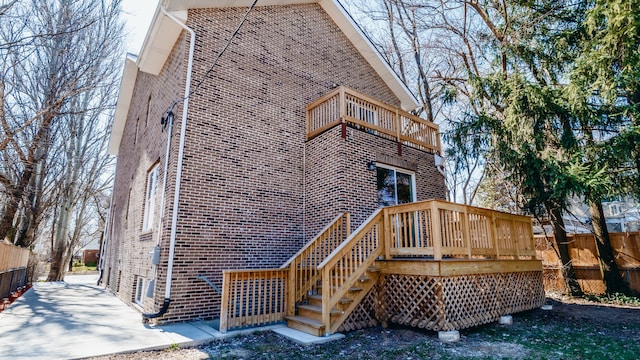 back of property featuring a balcony