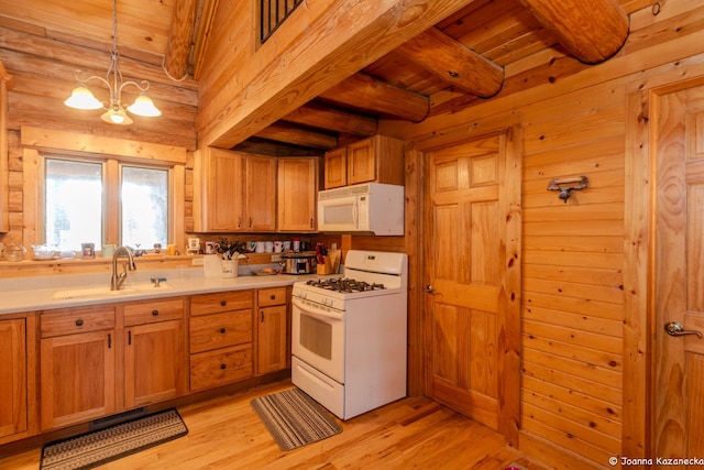 kitchen featuring light hardwood / wood-style floors, white appliances, beam ceiling, and wooden ceiling