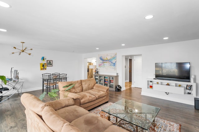 living room featuring dark wood-type flooring and a chandelier