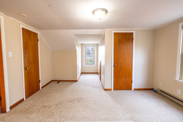 bonus room featuring baseboard heating and light carpet