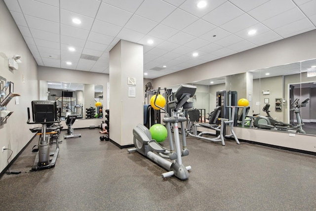 workout area featuring a drop ceiling