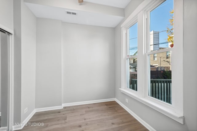 empty room with light hardwood / wood-style floors