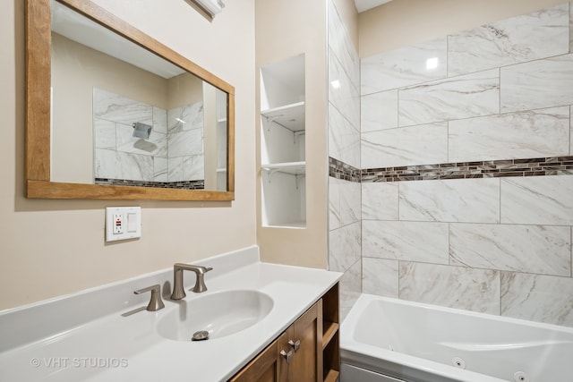 bathroom featuring tiled shower / bath combo and vanity