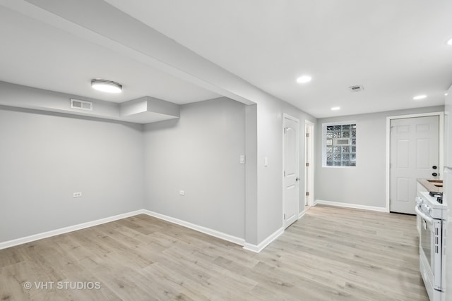 basement featuring light hardwood / wood-style floors