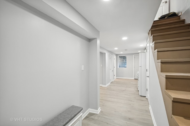 corridor with light wood-type flooring