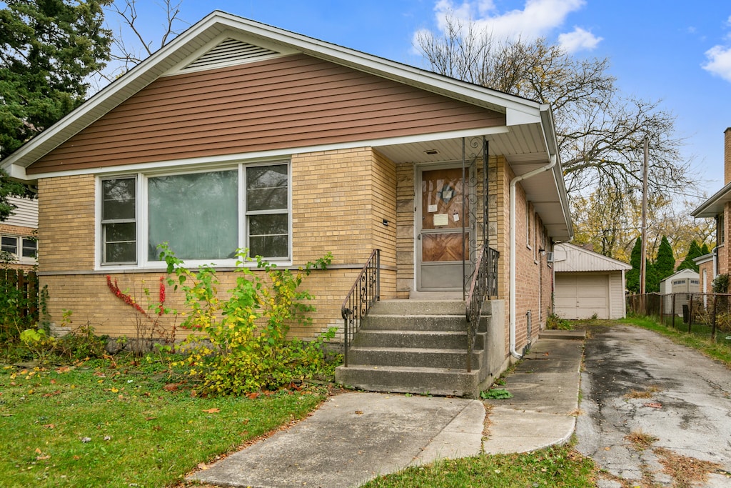 bungalow-style home with a garage