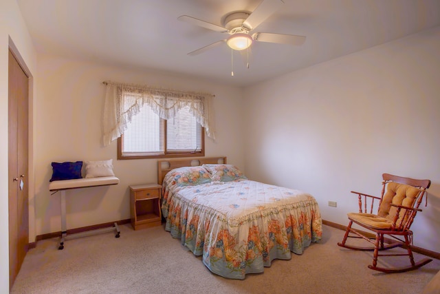 carpeted bedroom featuring a closet and ceiling fan