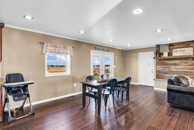 dining area featuring dark hardwood / wood-style flooring, french doors, and ornamental molding