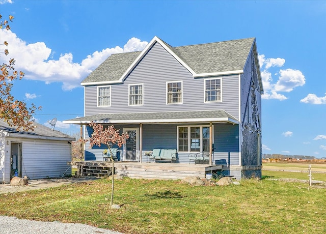 view of front of house featuring a front lawn and a porch