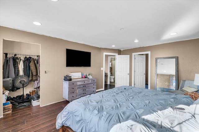 bedroom featuring dark wood-type flooring and a closet