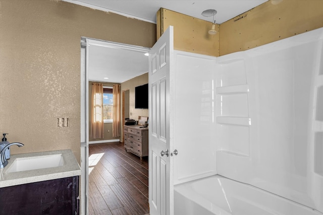 bathroom with hardwood / wood-style floors and vanity