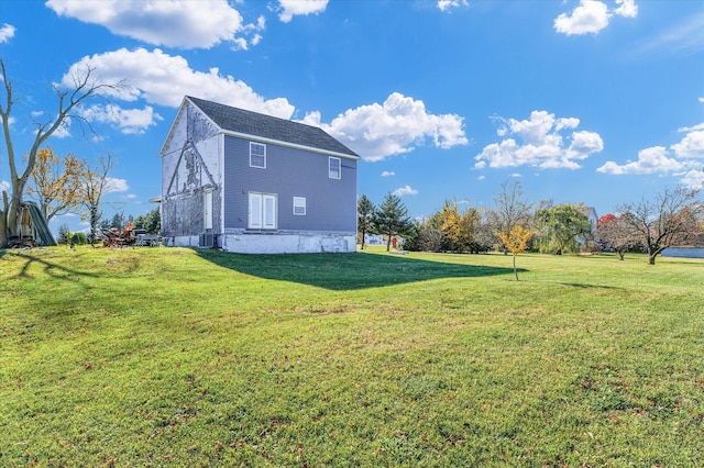 view of property exterior featuring a lawn