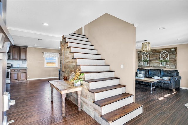 stairs with hardwood / wood-style flooring and crown molding