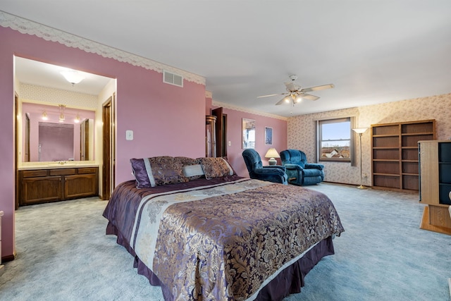 bedroom featuring light colored carpet, ceiling fan, and ornamental molding