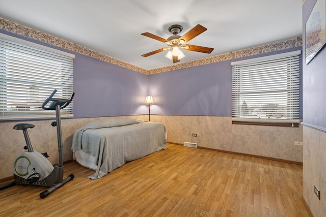 bedroom featuring ceiling fan and light hardwood / wood-style flooring