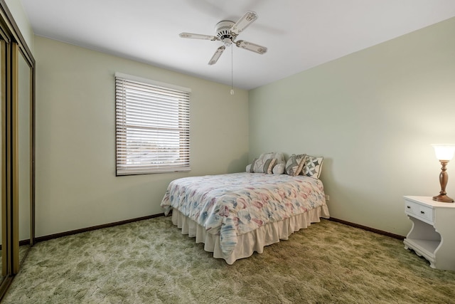 carpeted bedroom with a closet and ceiling fan