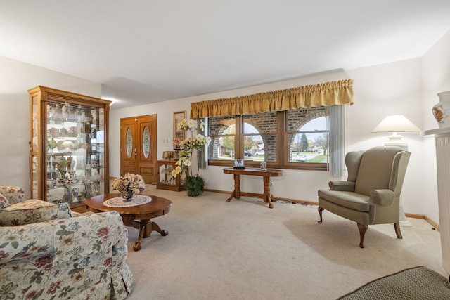 living area with light colored carpet