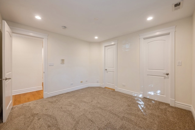 unfurnished room featuring carpet