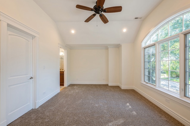 spare room with ceiling fan, carpet flooring, and lofted ceiling