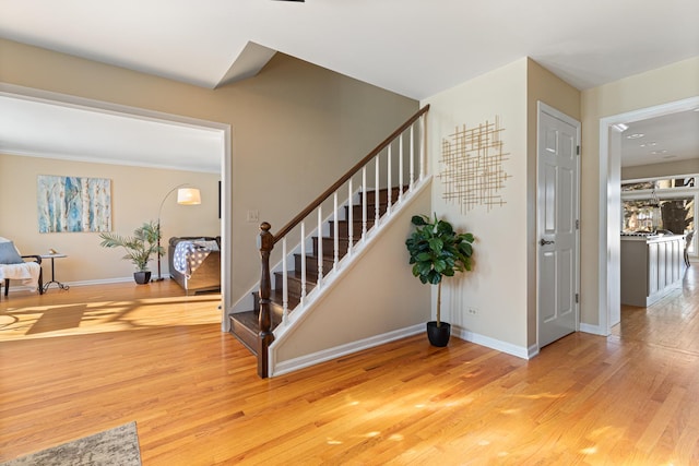 staircase featuring hardwood / wood-style flooring