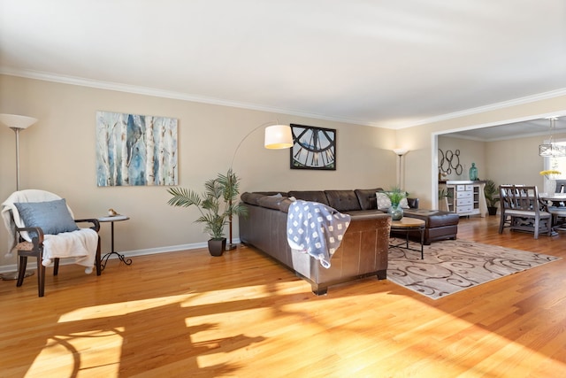 living room with ornamental molding and wood-type flooring