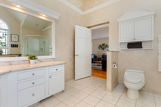 bathroom featuring an enclosed shower, vanity, tile patterned flooring, and vaulted ceiling