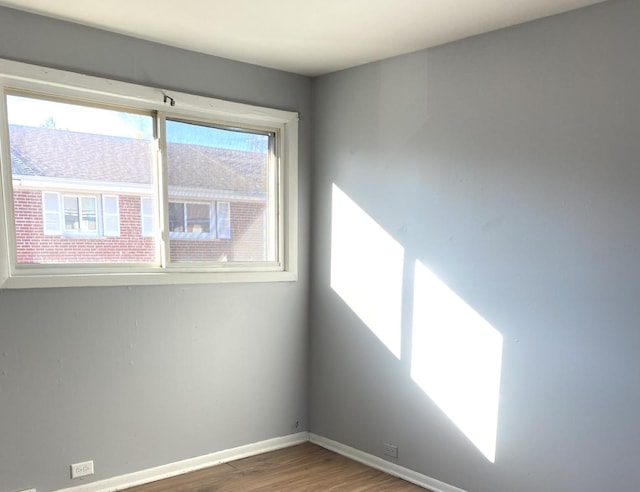 empty room featuring wood-type flooring