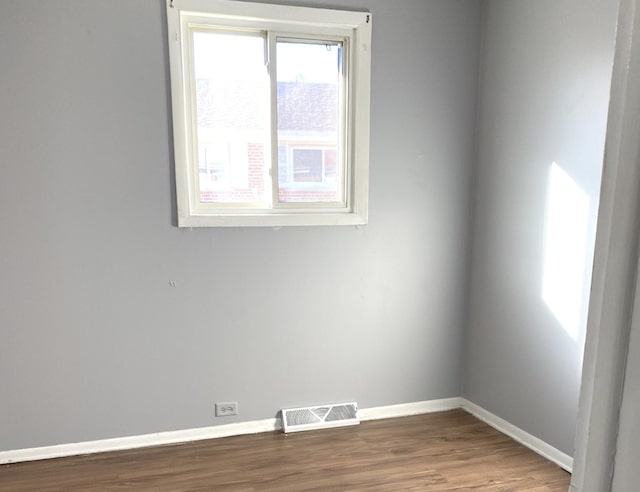 unfurnished room featuring hardwood / wood-style floors