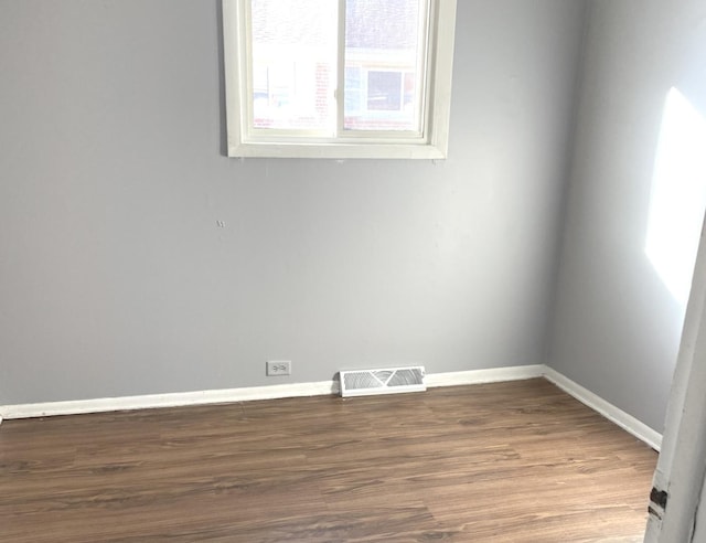 spare room featuring hardwood / wood-style floors