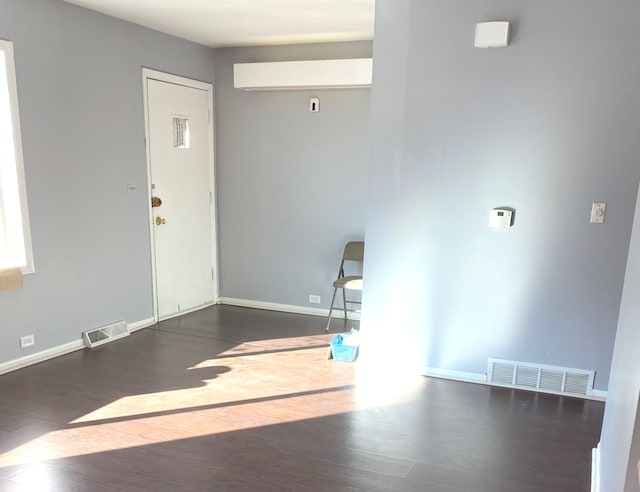 interior space with dark hardwood / wood-style floors