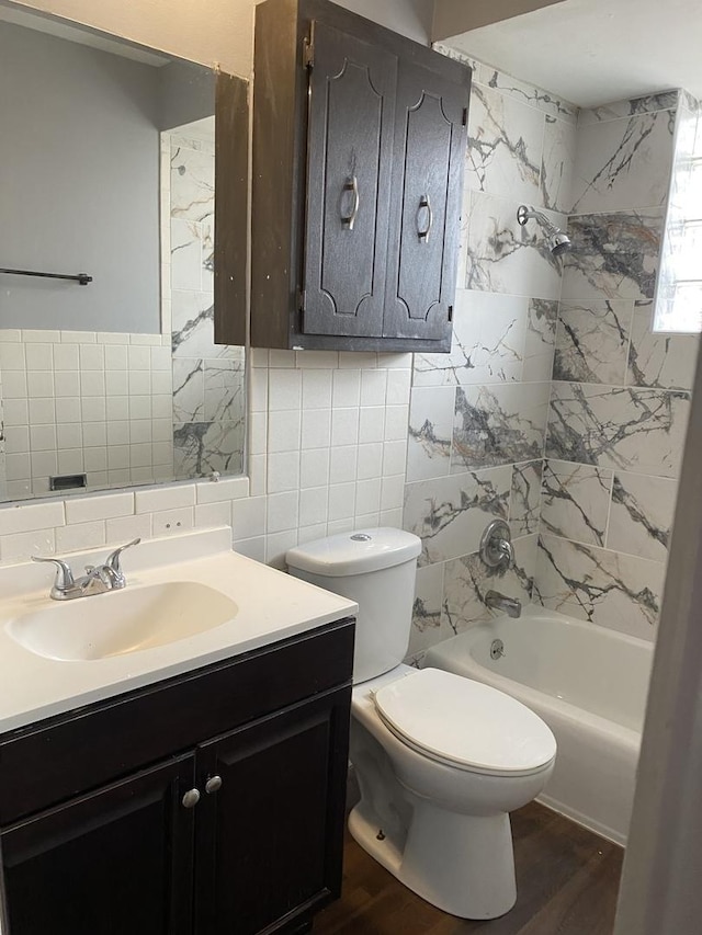 full bathroom with backsplash, vanity, wood-type flooring, tile walls, and toilet