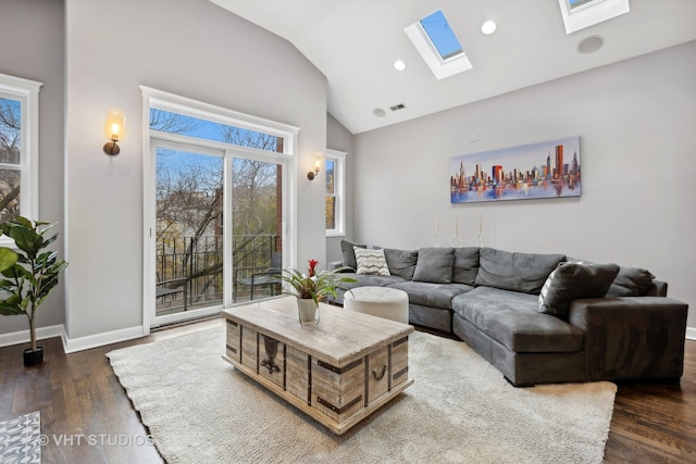 living room with dark hardwood / wood-style flooring and vaulted ceiling