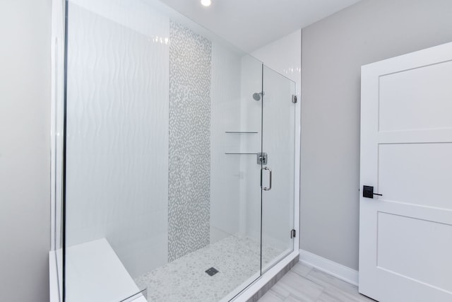 bathroom featuring an enclosed shower