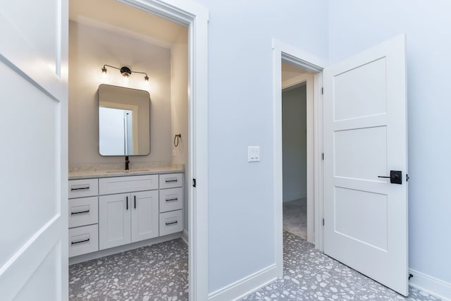 bathroom featuring tile patterned flooring and vanity