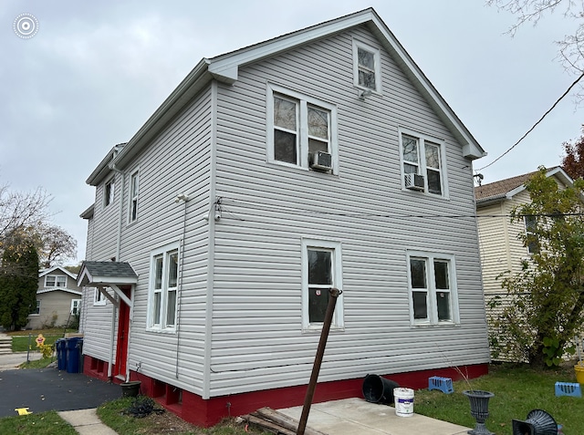 view of side of home featuring cooling unit