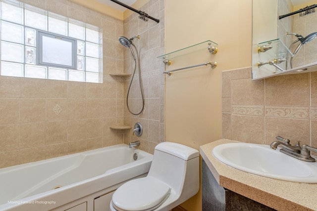 full bathroom with backsplash, toilet, tiled shower / bath, and sink