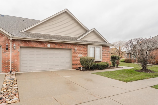 view of front of house featuring a garage and a front lawn