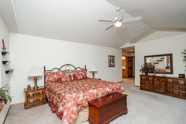 carpeted bedroom featuring ensuite bathroom, ceiling fan, and lofted ceiling