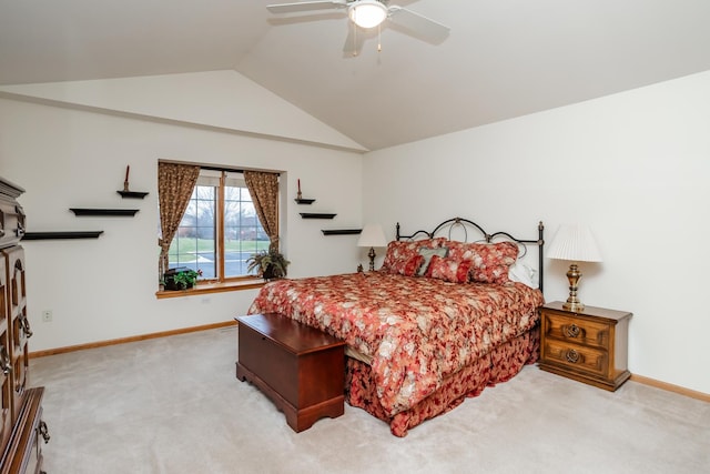 bedroom with ceiling fan, lofted ceiling, and light carpet