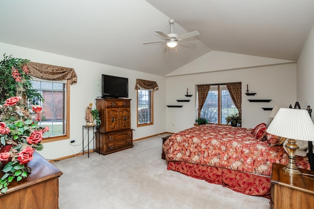 carpeted bedroom featuring ceiling fan and lofted ceiling