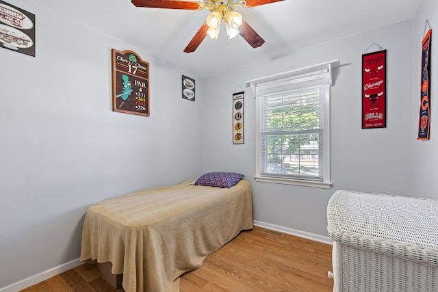 bedroom featuring light wood-type flooring and ceiling fan