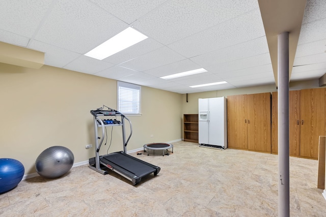 workout area featuring a paneled ceiling