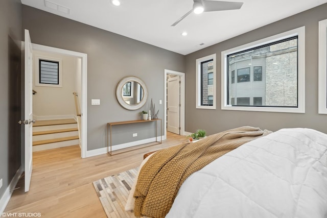 bedroom featuring ceiling fan and light hardwood / wood-style flooring