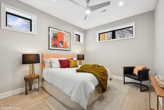 bedroom with ceiling fan and light wood-type flooring