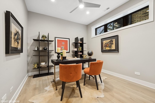 office area with ceiling fan and light hardwood / wood-style floors