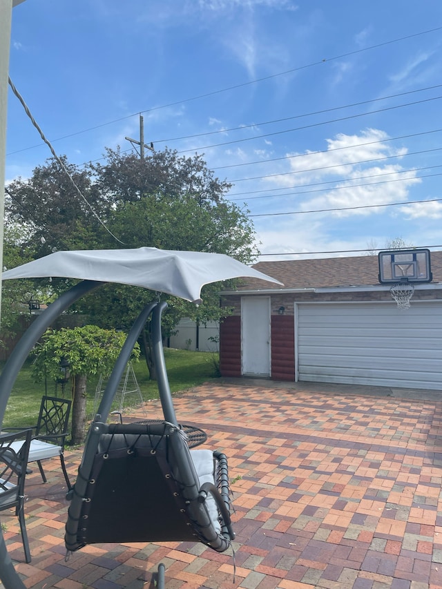 view of patio featuring a garage